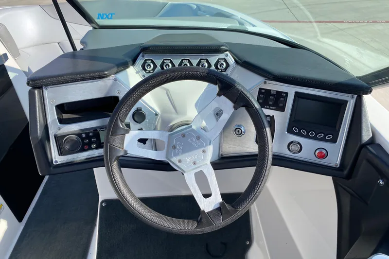 Slide: The Image of Steering console of 2017 MASTERCRFAT NXT 20 boat with modern controls and dashboard. - 12