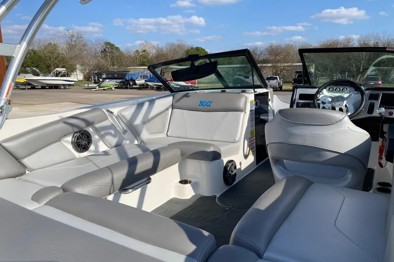 Slide: The Image of 2017 MASTERCRFAT NXT 20 boat interior with gray seating and steering wheel. - 14