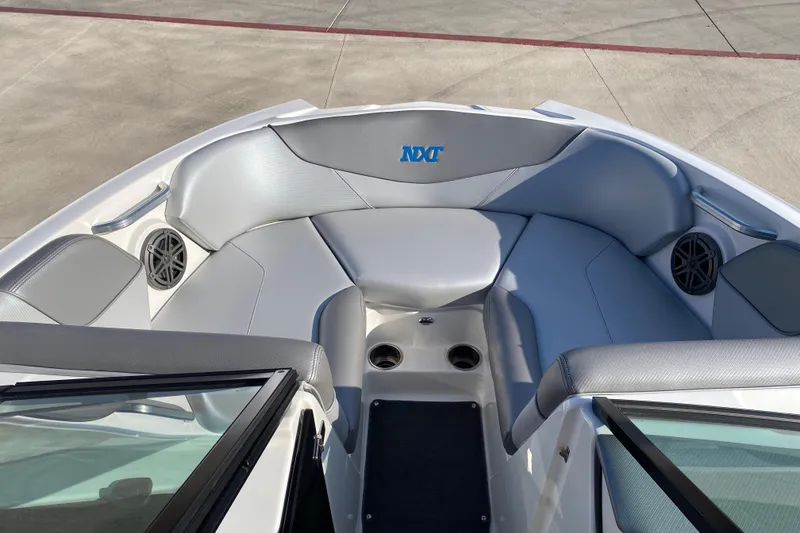 Slide: The Image of Interior of 2017 MASTERCRFAT NXT 20 boat with gray seating and speakers. - 15