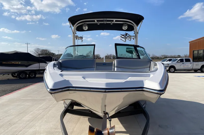 Slide: The Image of 2017 MASTERCRFAT NXT 20 boat on trailer under clear blue sky. - 2