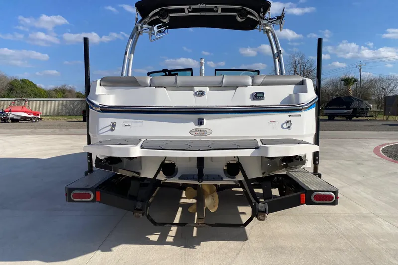 Slide: The Image of 2017 MASTERCRFAT NXT 20 boat rear view on concrete, clear sky background. - 4