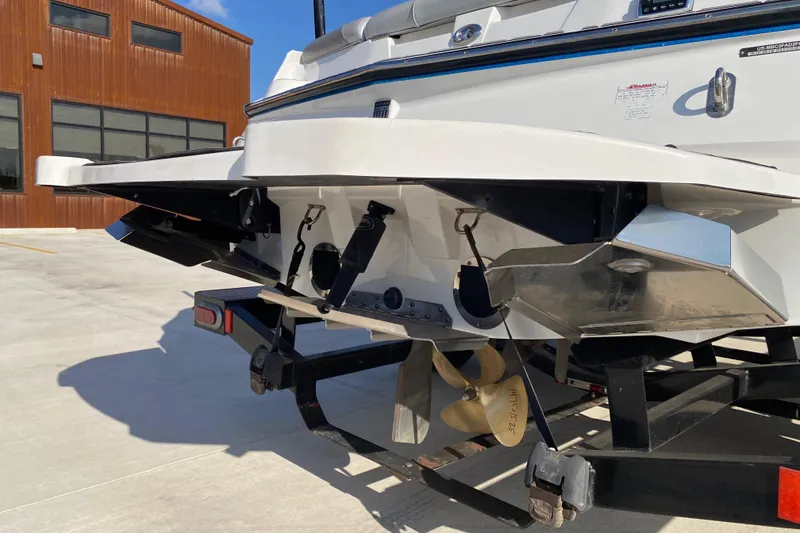 Slide: The Image of Rear view of 2017 MASTERCRFAT NXT 20 boat on trailer, showcasing propeller and hull design. - 5