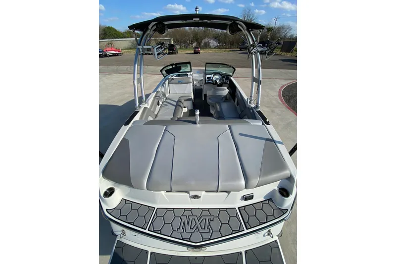 Slide: The Image of 2017 MASTERCRFAT NXT 20 boat, gray interior, open deck, parked outdoors. - 6