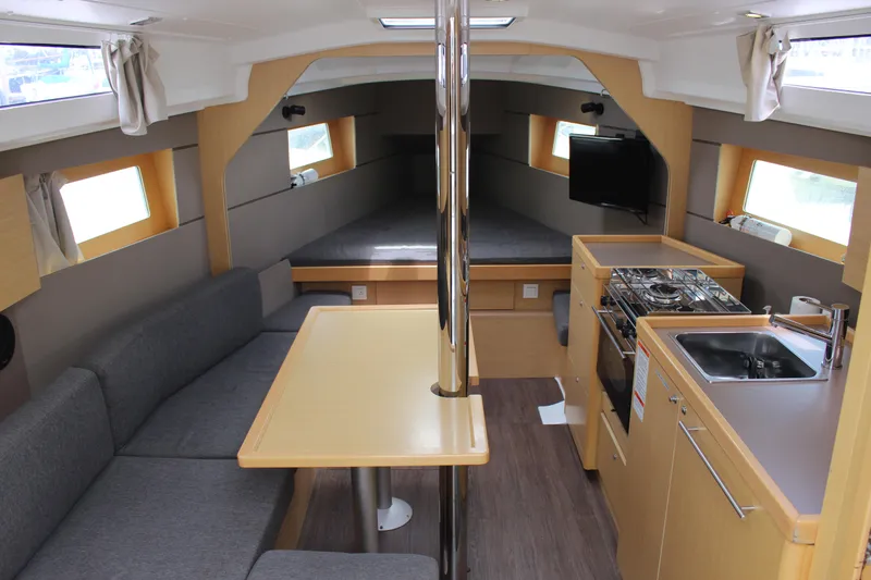 Slide: The Image of Sailing yacht Beneteau Oceanis 35, 2015 model, on calm water with clear blue sky. - 8