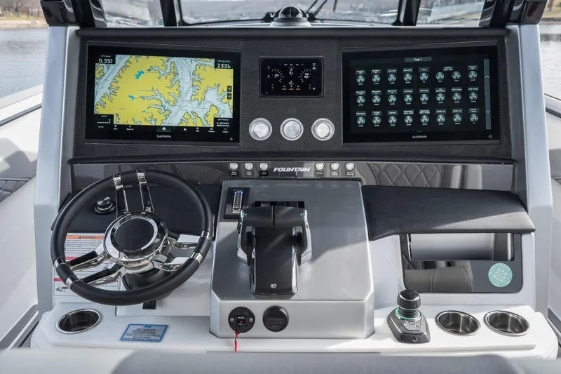 Slide: The Image of 2026 Fountain 38 SCX boat dashboard with advanced navigation and control systems. - 21