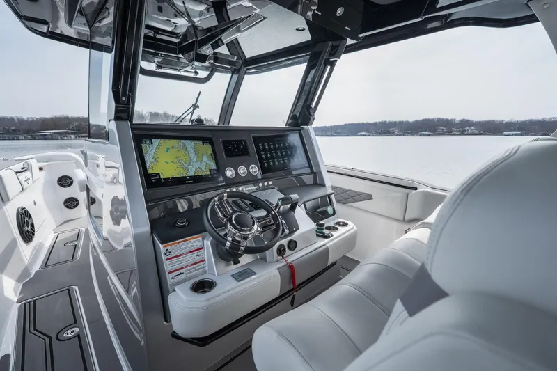 Slide: The Image of 2026 Fountain 38 SCX boat cockpit with advanced navigation system and luxurious seating. - 23