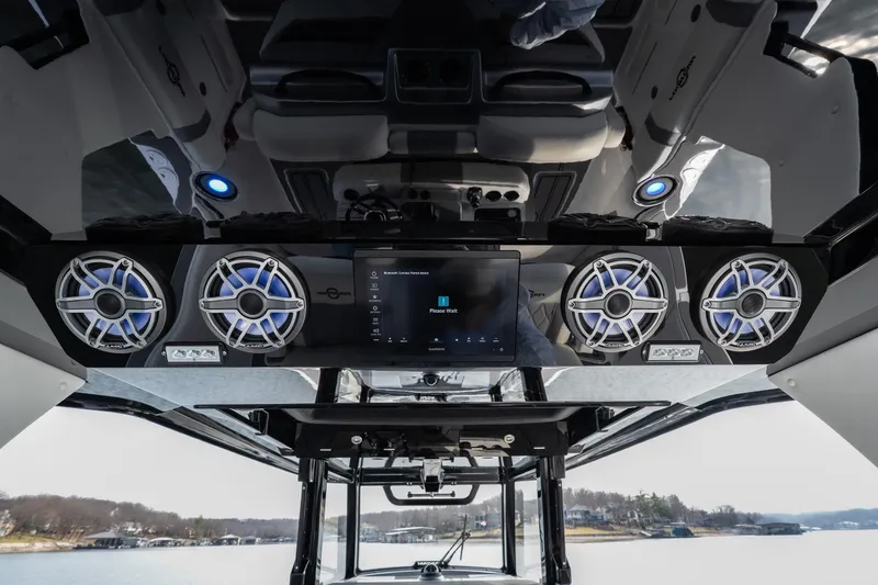 Slide: The Image of 2026 Fountain 38 SCX boat interior with advanced audio system and sleek design. - 34