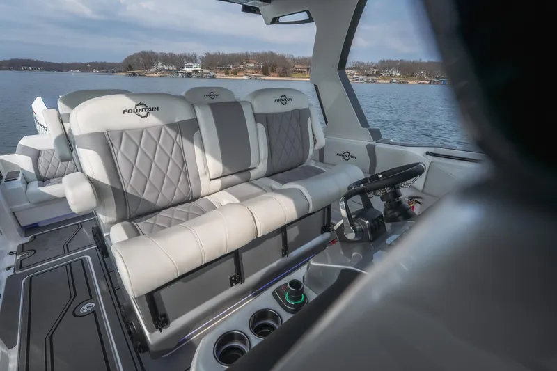 Slide: The Image of 2026 Fountain 38 SCX boat interior with luxurious seating and modern steering console. - 41