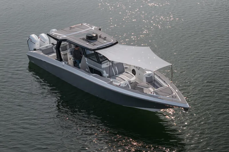 Slide: The Image of 2026 Fountain 38 SCX boat on water, featuring sleek design and modern amenities. - 50