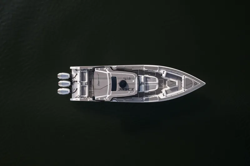 Slide: The Image of Top view of 2026 Fountain 38 SCX boat with triple engines on dark water. - 52