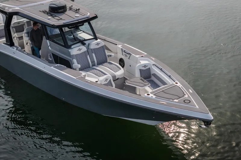 Slide: The Image of 2026 Fountain 38 SCX boat on calm water, featuring sleek design and modern seating. - 53