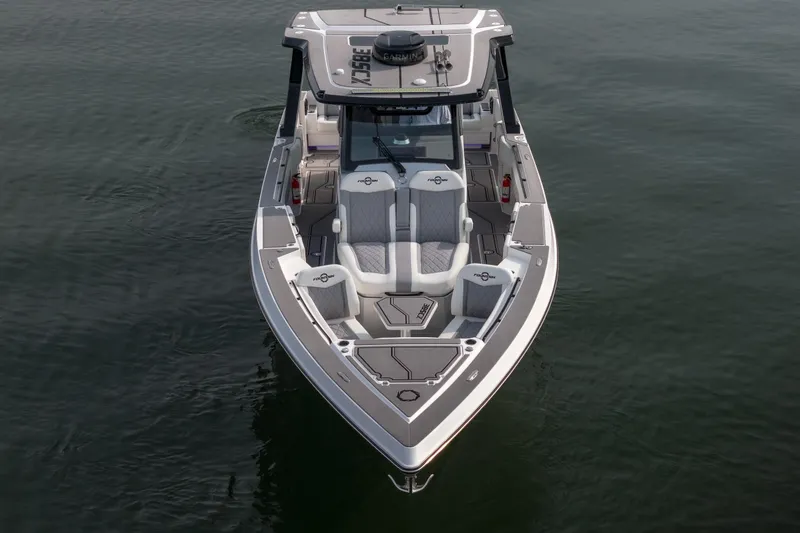 Slide: The Image of 2026 Fountain 38 SCX boat on calm water, showcasing sleek design and spacious seating. - 54