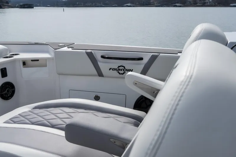 Slide: The Image of 2026 Fountain 38 SCX boat interior with luxurious seating and lake view. - 7