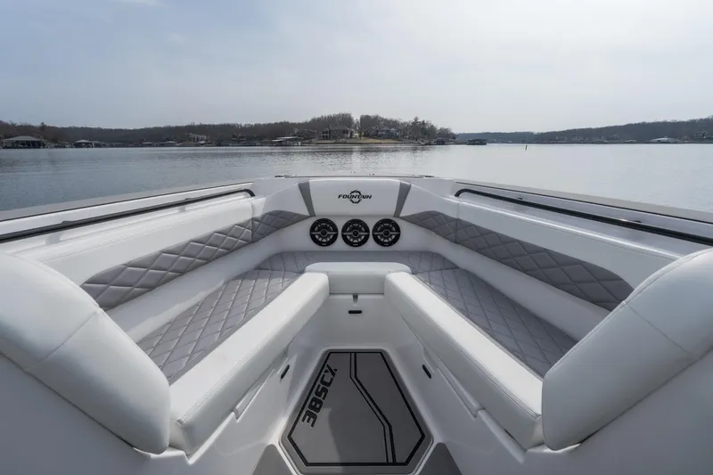 Slide: The Image of 2026 Fountain 38 SCX boat interior with luxurious seating and lake view. - 8