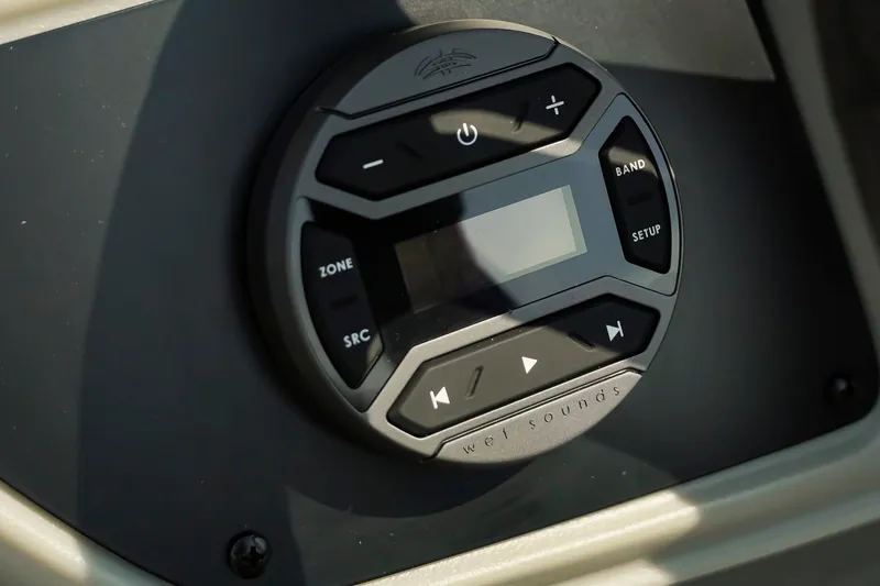 Slide: The Image of Control panel of 2026 Dockside 20 DQ boat with audio system interface. - 20