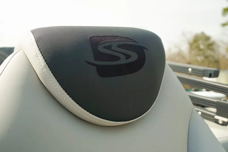 Slide: The Image of Close-up of Dockside 20 DQ 2026 boat seat with logo detail. - 25