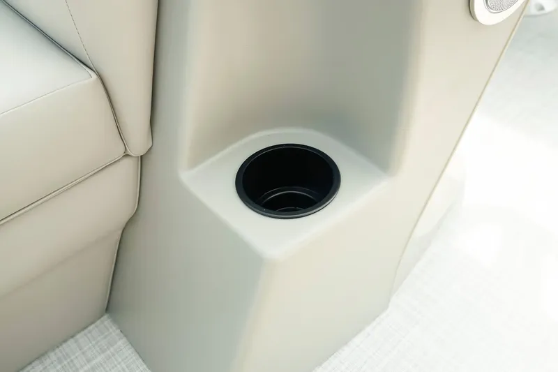 Slide: The Image of Cup holder in 2026 Dockside 20 DQ boat, beige interior detail. - 27