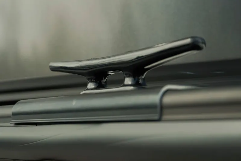 Slide: The Image of Close-up of a Dockside 20 DQ 2026 boat cleat, showcasing sleek design. - 33