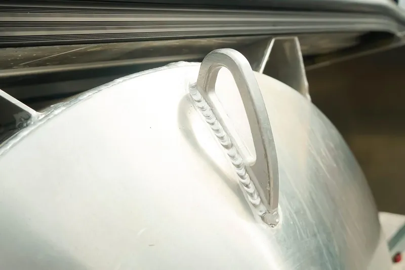 Slide: The Image of Close-up of Dockside 20 DQ 2026 boat's metal handle and weld detail. - 36