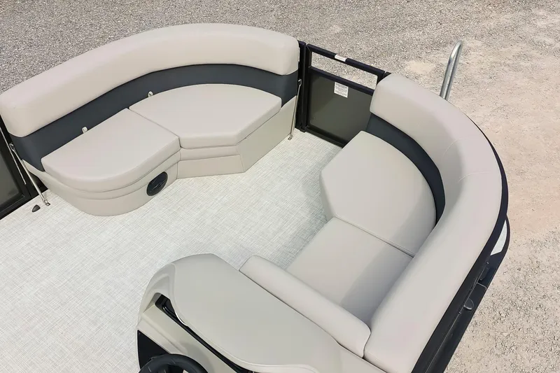 Slide: The Image of 2026 Dockside 20 DQ boat interior with beige seating and spacious layout. - 9