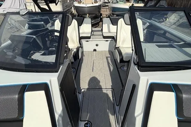 Slide: The Image of 2023 Yamaha Boats 222XE interior with modern seating and sleek design. - 13