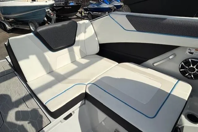 Slide: The Image of 2023 Yamaha Boats 222XE interior seating with sleek design and modern upholstery. - 16