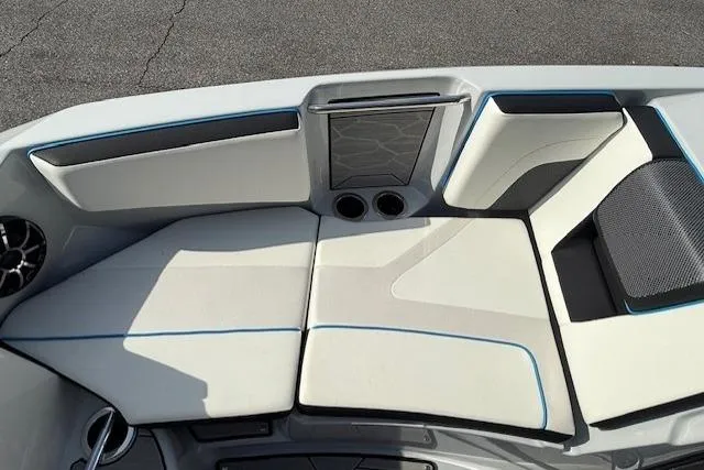 Slide: The Image of 2023 Yamaha Boats 222XE interior seating with modern design and cup holders. - 17