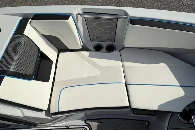 Slide: The Image of 2023 Yamaha Boats 222XE interior seating with modern design and cup holders. - 18
