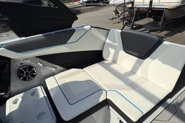 Slide: The Image of 2023 Yamaha Boats 222XE interior seating with modern design and comfortable upholstery. - 19