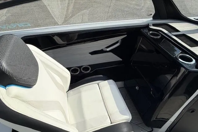 Slide: The Image of 2023 Yamaha Boats 222XE interior with sleek white seating and modern design elements. - 21