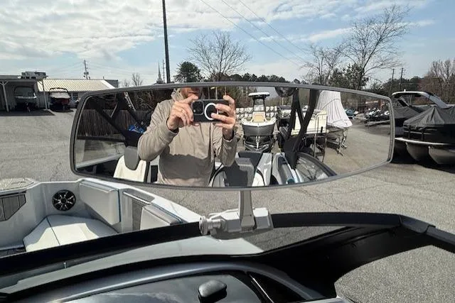 Slide: The Image of 2023 Yamaha Boats 222XE interior with rearview mirror reflection. - 24