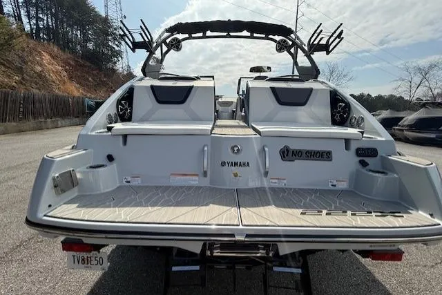Slide: The Image of 2023 Yamaha Boats 222XE rear view, showcasing swim platform and sleek design. - 6