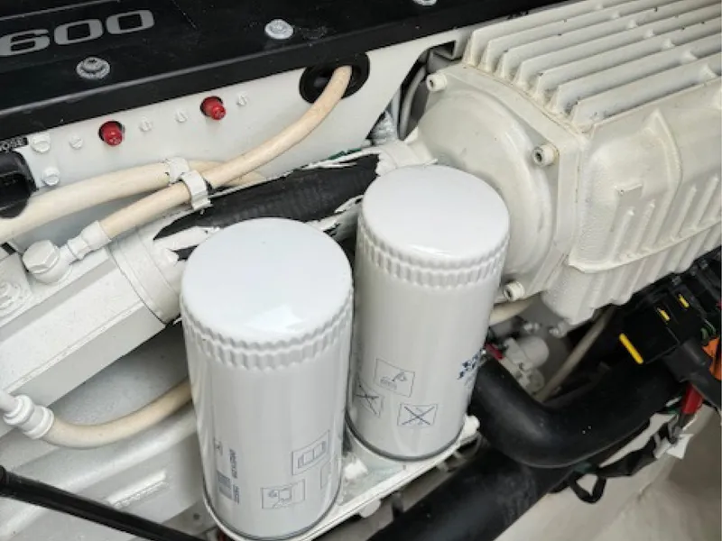 Slide: The Image of Engine components of 2017 Sabre 45 Salon Express yacht, featuring filters and wiring. - 15