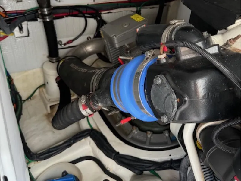 Slide: The Image of Engine compartment of 2017 Sabre 45 Salon Express with visible hoses and wiring. - 16