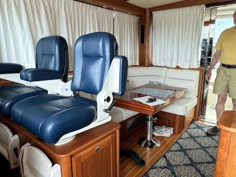 Slide: The Image of Interior of 2017 Sabre 45 Salon Express with blue seats and wooden accents. - 5