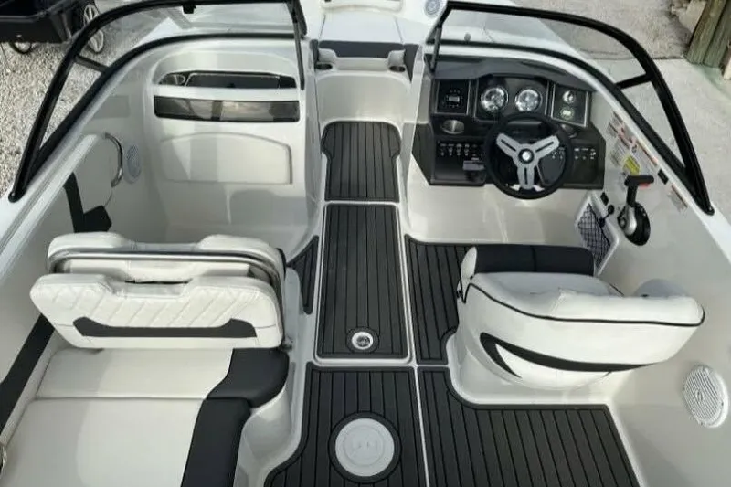 Slide: The Image of 2023 Bayliner VR5 Bowrider I/O interior with sleek seating and modern dashboard design. - 2