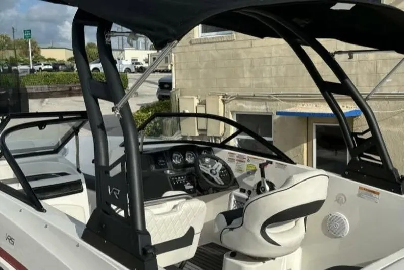 Slide: The Image of 2023 Bayliner VR5 Bowrider I/O boat interior with steering wheel and seating. - 3