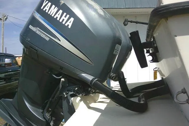 Slide: The Image of Yamaha outboard motor on 2002 Parker 2501 Center Console boat, side view. - 12