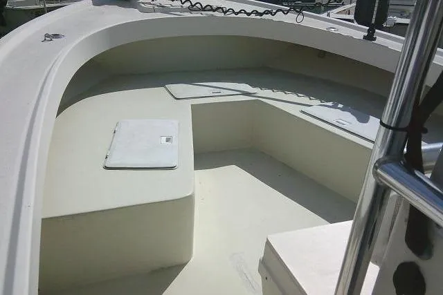 Slide: The Image of 2002 Parker 2501 Center Console boat interior with seating and storage compartments. - 13