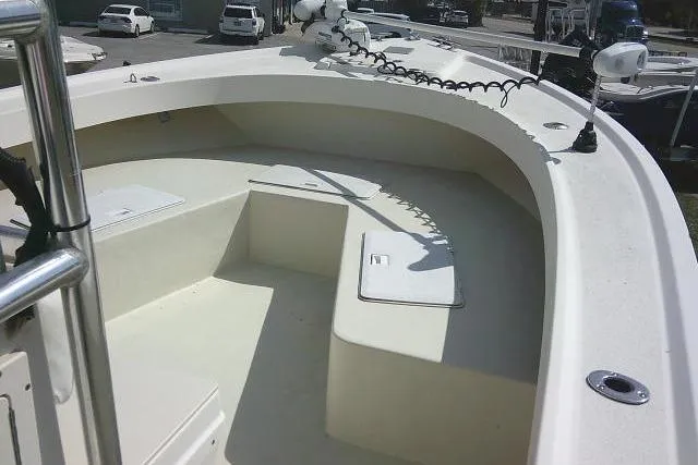 Slide: The Image of 2002 Parker 2501 Center Console boat deck with seating and storage compartments. - 20