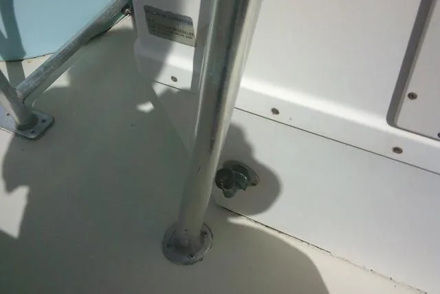 Slide: The Image of 2002 Parker 2501 Center Console boat deck with metal railing and fittings. - 27