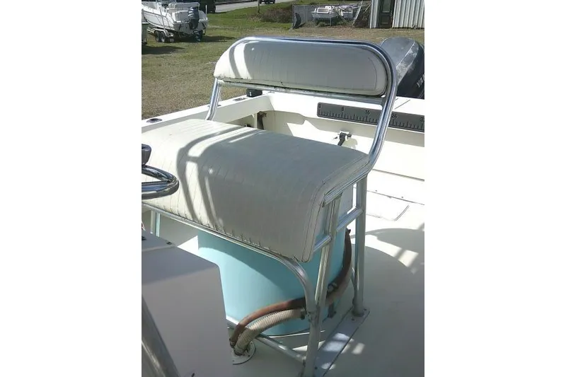 Slide: The Image of 2002 Parker 2501 Center Console boat seat with metal frame and cushioned backrest. - 30