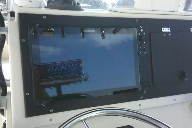 Slide: The Image of Console of 2002 Parker 2501 Center Console boat with Simrad display. - 33