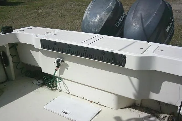 Slide: The Image of 2002 Parker 2501 Center Console boat with Yamaha engines, featuring a built-in measuring scale. - 35