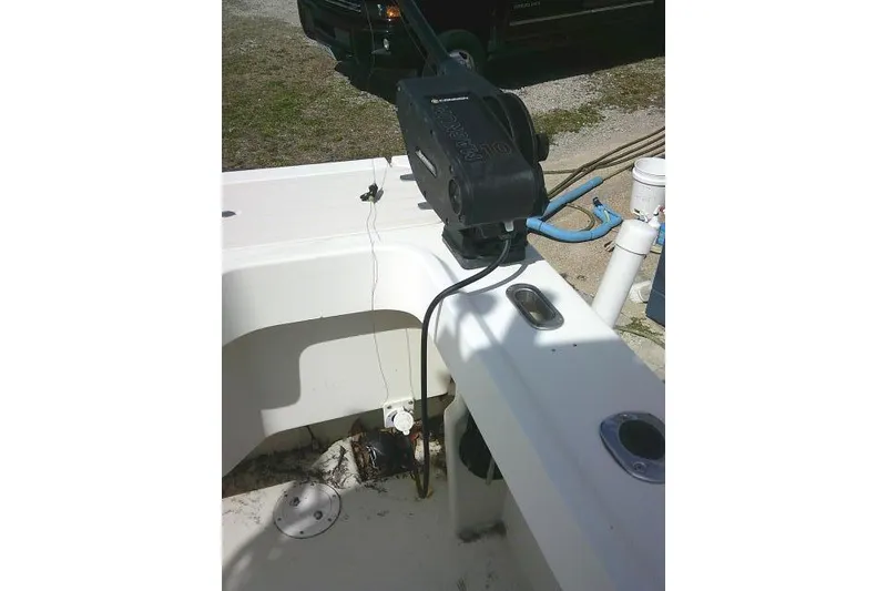 Slide: The Image of 2002 Parker 2501 Center Console boat with fishing equipment on deck. - 36