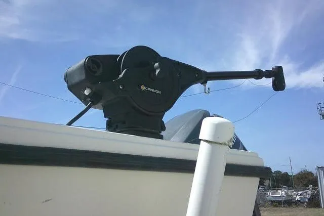 Slide: The Image of 2002 Parker 2501 Center Console boat with mounted fishing equipment under clear sky. - 7