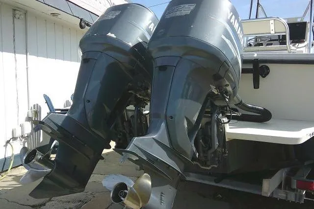 Slide: The Image of Twin Yamaha outboard engines on a 2002 Parker 2501 Center Console boat. - 9