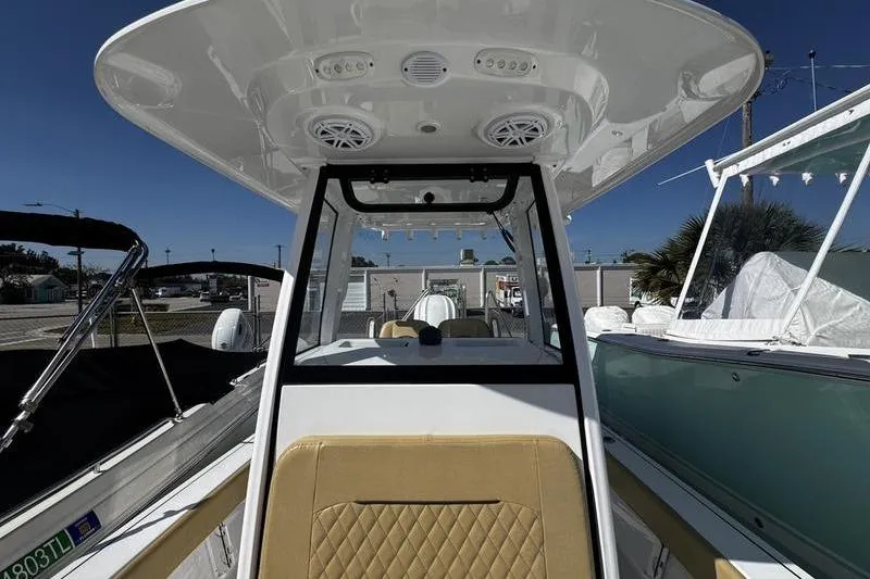 Slide: The Image of 2026 Sportsman Masters 247 Bay Boat interior with modern console and seating. - 10