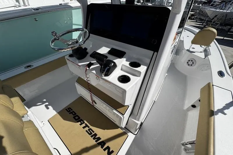 Slide: The Image of 2026 Sportsman Masters 247 Bay Boat cockpit with steering wheel and control panel. - 17