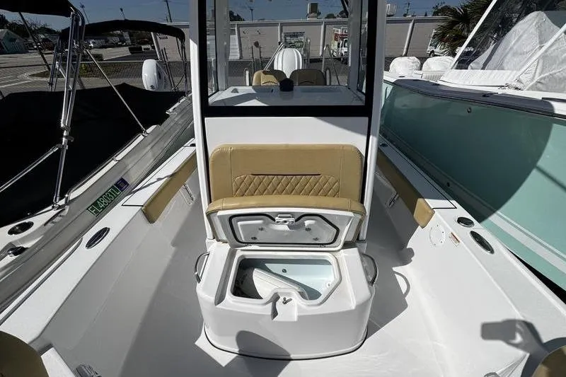 Slide: The Image of 2026 Sportsman Masters 247 Bay Boat interior with open storage compartment. - 13